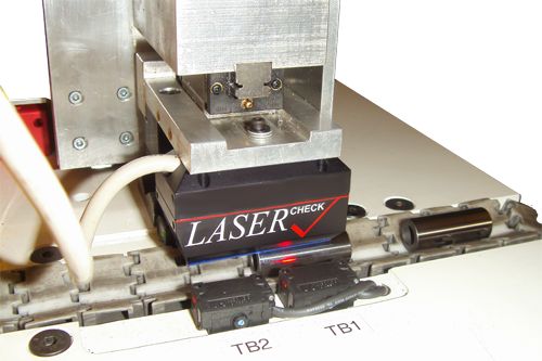 6212POM System measuring roughness of wrist pins on conveyor output of Through Feed Polisher